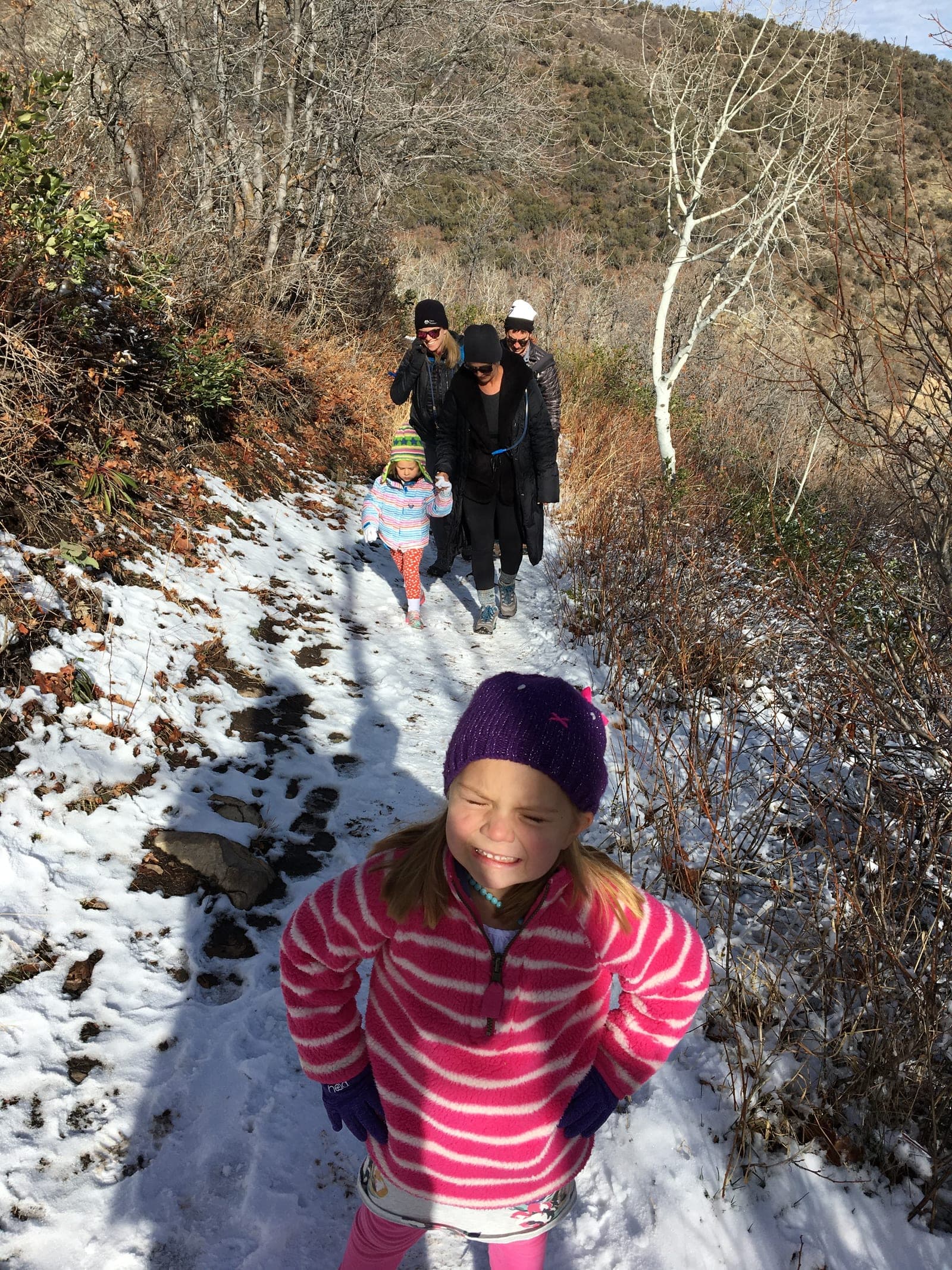 Bundled-up hikers on a snowy Rob's Trail in winter